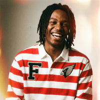 Model wearing Color Block Stripe Polo Shirt in red and white with embroidered F and bird logo, styled for casual streetwear fashion.