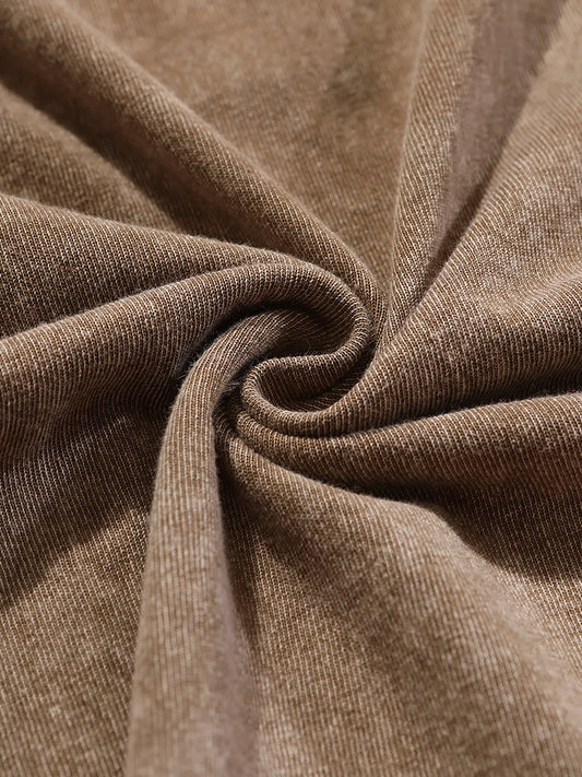 Brown textured fabric with stitched seam