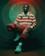 Model wearing Color Block Stripe Polo Shirt in red and white with embroidered F and bird logo, styled for casual streetwear fashion.