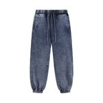 Dark blue unisex sweatpants in snow wash finish with drawstring waist and pockets. Comfortable cotton blend for versatile casual outfits.
