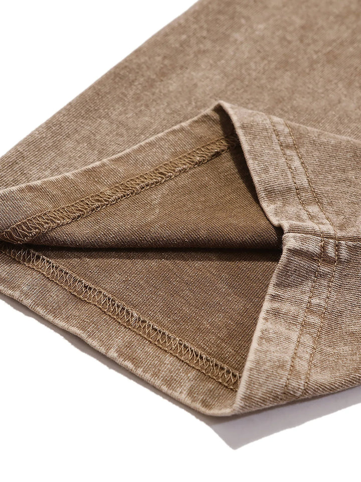 Brown textured fabric with stitched seam