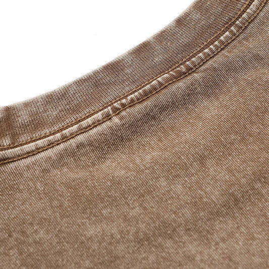 Brown textured fabric with stitched seam
