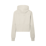 Back view of beige cropped half-zip hoodie for women, showcasing hood and curved seam details for a modern athletic look.