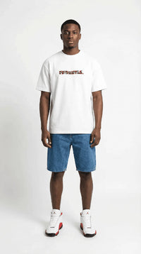 Model wearing white heavyweight cotton T-shirt with colorful geometric logo on front, denim shorts, and white sneakers
