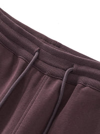 Close-up of waistband on brown Essential Drawstring Straight-Leg Sweatpants with ribbed texture and adjustable drawstring.