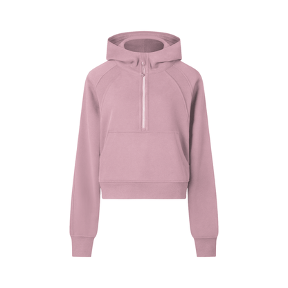 Pink cropped half-zip hoodie for women designed for gym or casual wear, featuring ribbed hem and sporty silhouette.