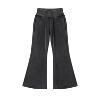 Vintage Washed Flared Fleece Pants in black with drawstring waist and front pockets. Casual cotton blend ideal for everyday wear.