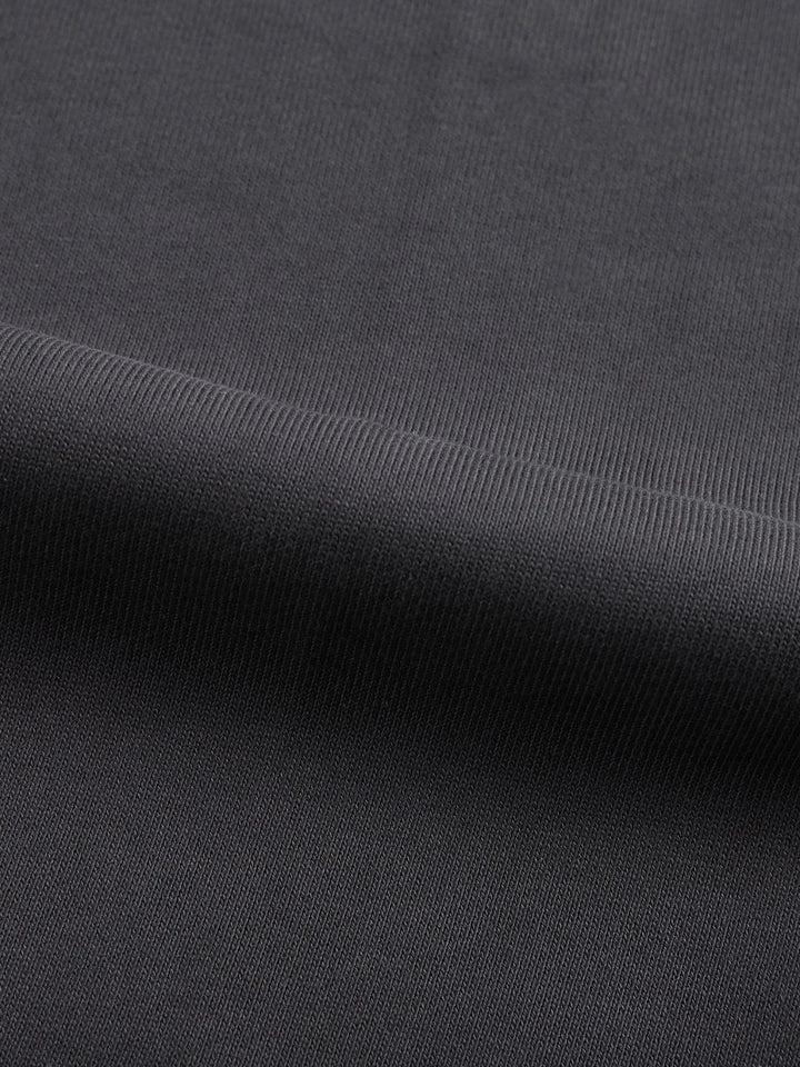 Fabric close-up of Mr Rogers FNDMNTLS Flared Sweatpants, revealing soft cotton texture ideal for all-season comfort.