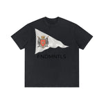 Dark Gray Standard Bearer Vintage Wash T-Shirt with a waving flag and medieval crest with the brand name, FNDMNTLS, below the flag