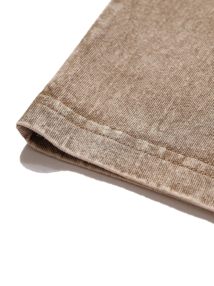 Brown textured fabric with stitched seam