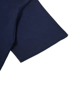 Close-up of navy fabric and sleeve hem