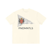 Light apricot color Standard Bearer Vintage Wash T-Shirt with a waving flag and medieval crest with the brand name, FNDMNTLS, below the flag
