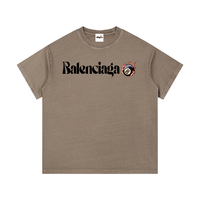 Brown Balenciaga Vintage Wash Cotton T-Shirt with neck label, featuring bold logo and flaming 8-ball graphic for relaxed outfits.