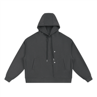 Front view of charcoal Essential Cotton T-Shirt hoodie with dual snap buttons and kangaroo pockets for functional streetwear.