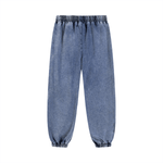 Rear view of light blue unisex sweatpants with elastic waistband and ankle cuffs. Perfect for casual and loungewear fashion.