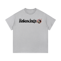 Light grey Balenciaga Vintage Wash Cotton T-Shirt with bold black logo and flaming 8-ball graphic, designed for casual wear.