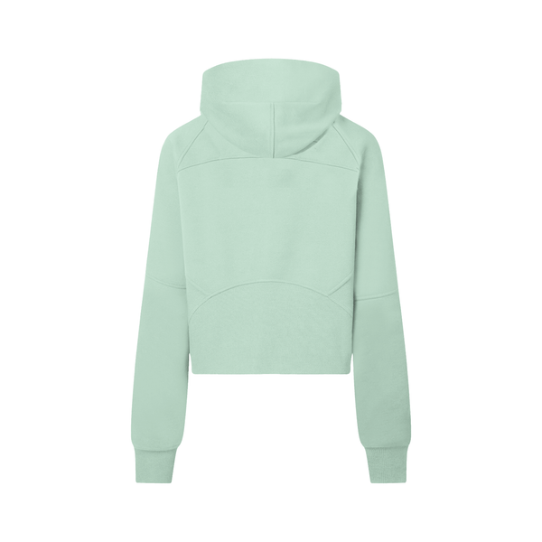 Rear view of mint green cropped half-zip hoodie for women, highlighting the structured paneling and relaxed fit.