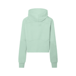 Rear view of mint green cropped half-zip hoodie for women, highlighting the structured paneling and relaxed fit.