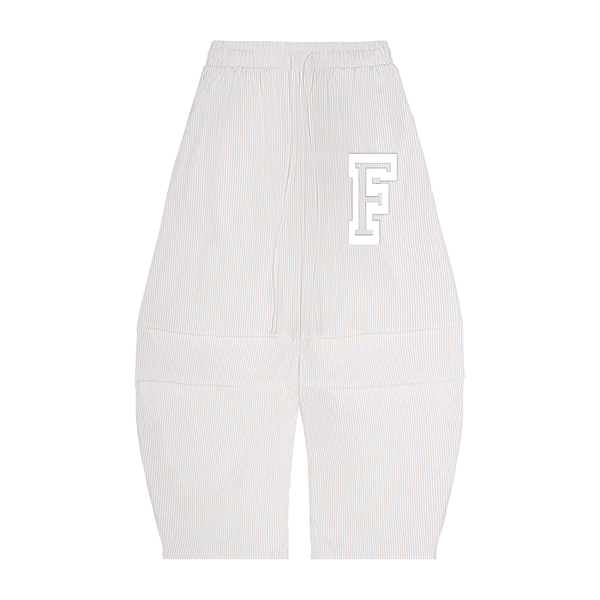 White ribbed pants with a large white letter 'F' on a white background