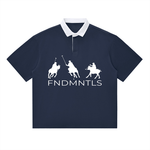 Navy blue contrast polo shirt with white collar and FNDMNTLS logo, unisex cotton blend for stylish casual wear.