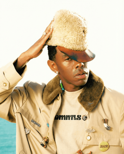 Model layering Mineral Wash Boxy Cotton T-Shirt under a beige jacket with pins, showcasing casual streetwear style.