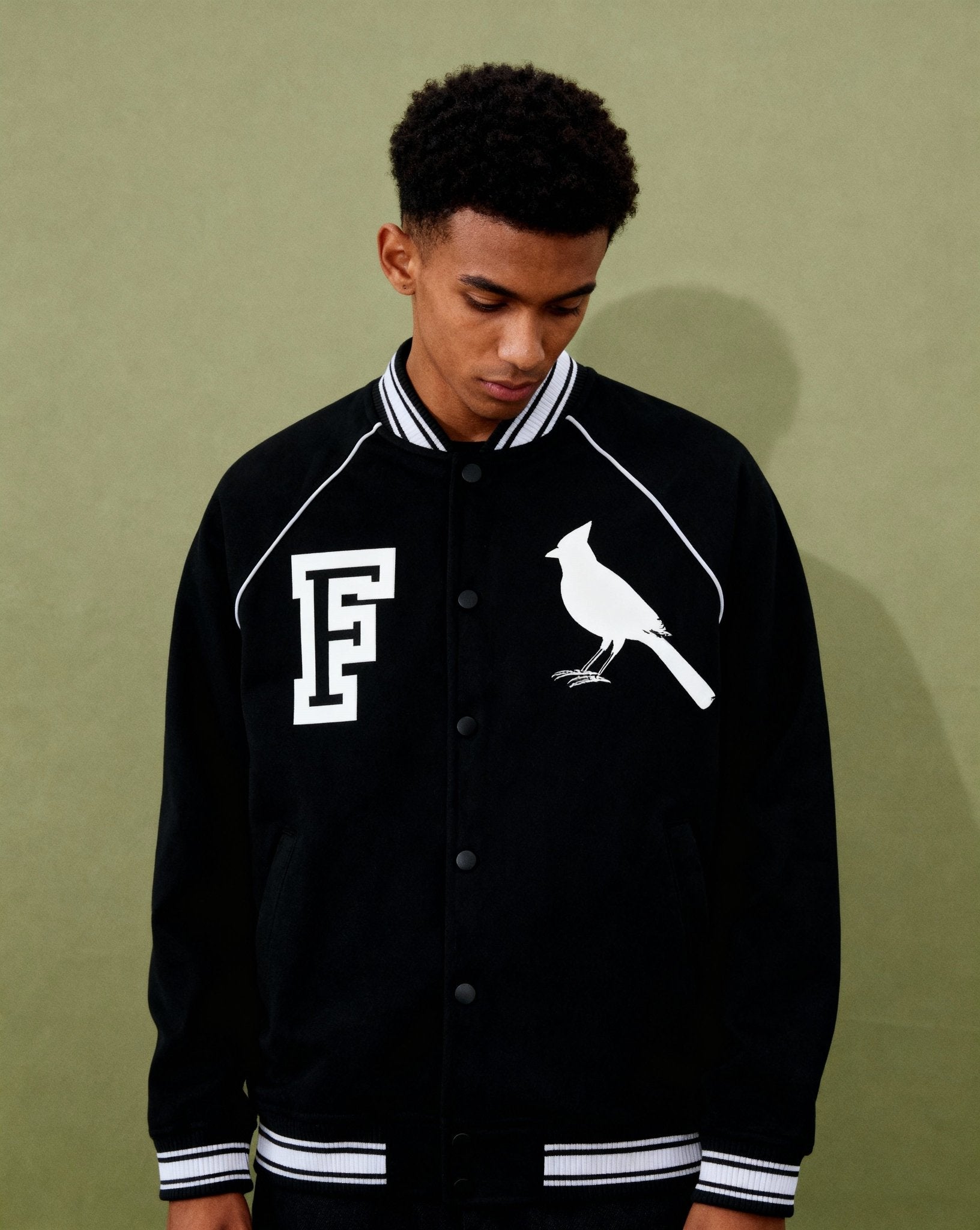 Model wearing Chrome Cardinal Contrast Trim Varsity Jacket | FNDMNTLS