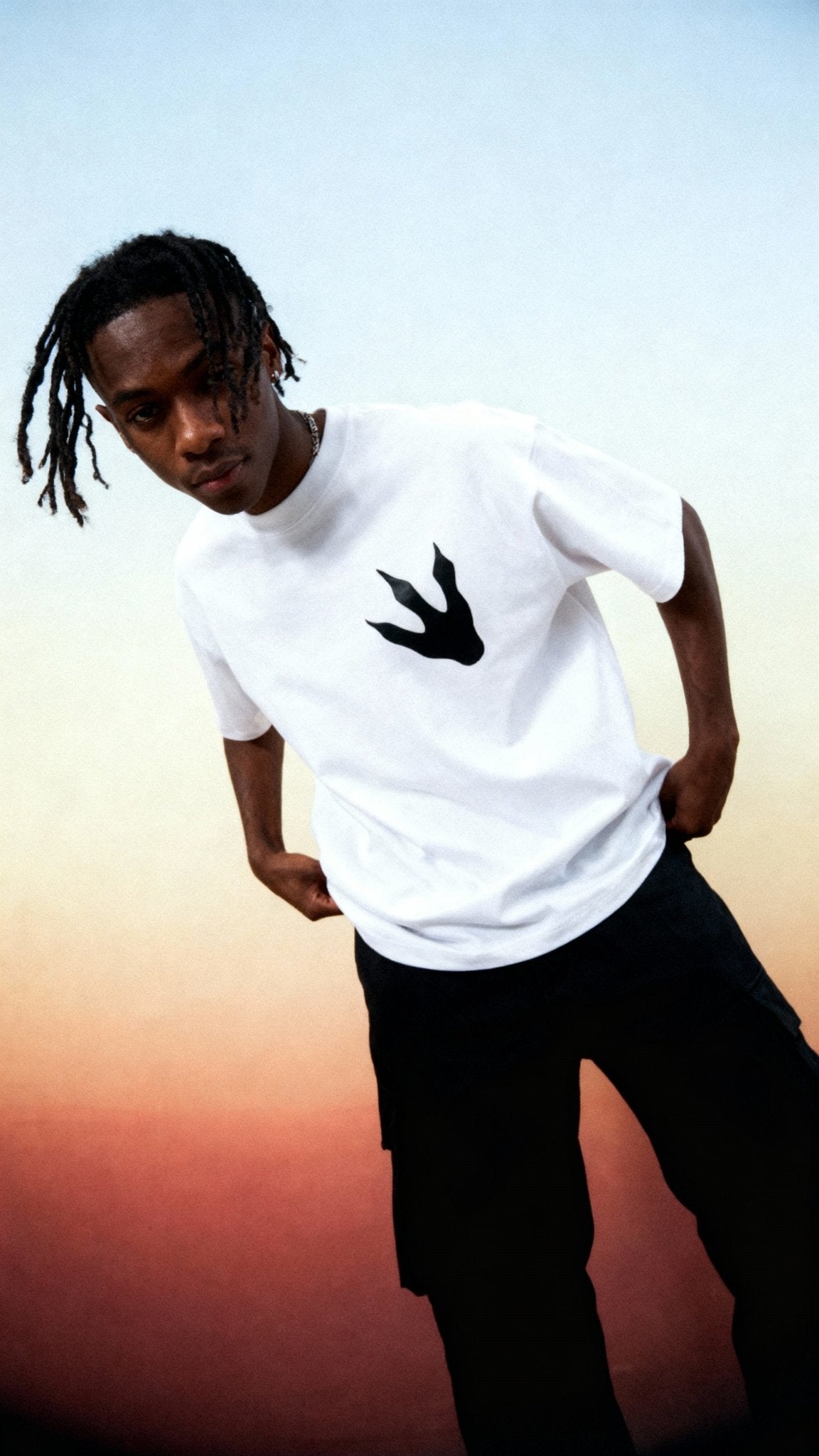 Model wearing Jurassic Fndmntls Footprint Tee
