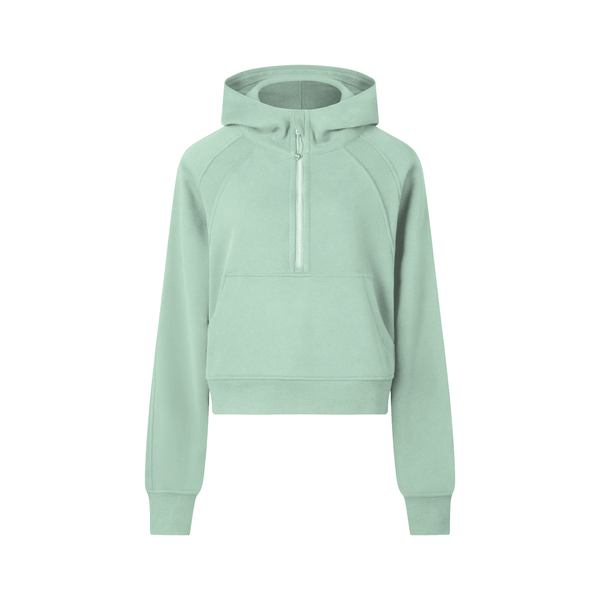 Mint green cropped half-zip hoodie for women with a front kangaroo pocket and hood, perfect for sporty comfort and casual outfits.