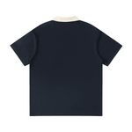 Back of the dark blue unisex polo shirt with contrast collar and embroidered F and cardinal logos