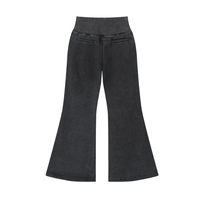 Back view of black Vintage Washed Flared Fleece Pants featuring faux back pockets and flared leg design for a relaxed fit.