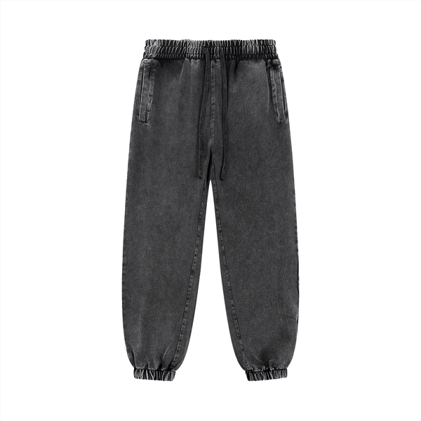 Unisex snow wash sweatpants in charcoal black with drawstring waist and side pockets. Cotton blend fabric ideal for casual and outdoor wear.