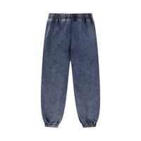 Back view of dark blue unisex sweatpants with elastic waist and cuffs. Ideal for relaxed, stylish everyday wear.