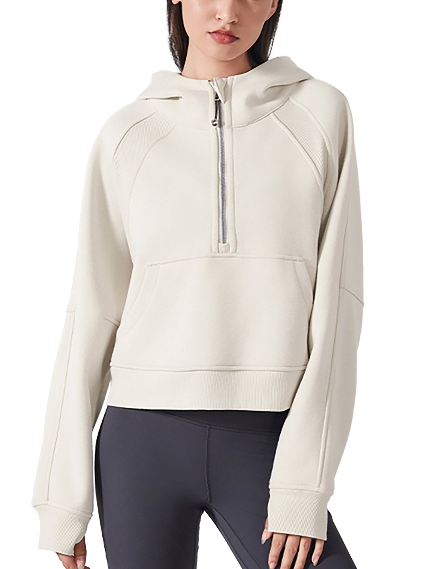Model wearing beige cropped half-zip hoodie for women paired with black leggings, ideal for workouts or casual outings.