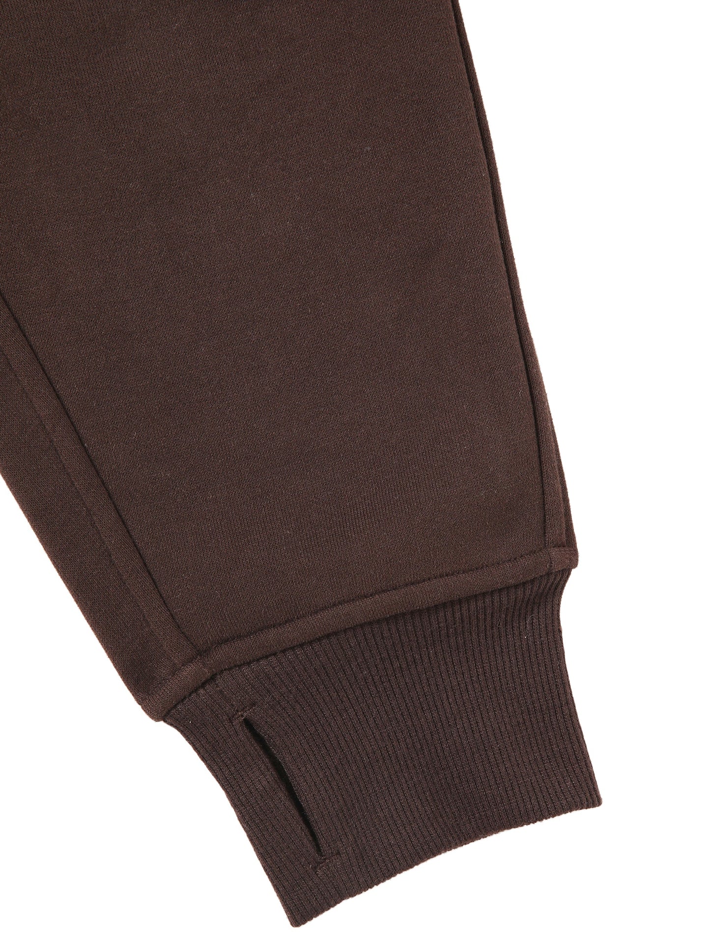 Detail of sleeve and cuff on chocolate brown cropped half-zip hoodie for women, featuring ribbed knit and thumbhole design.