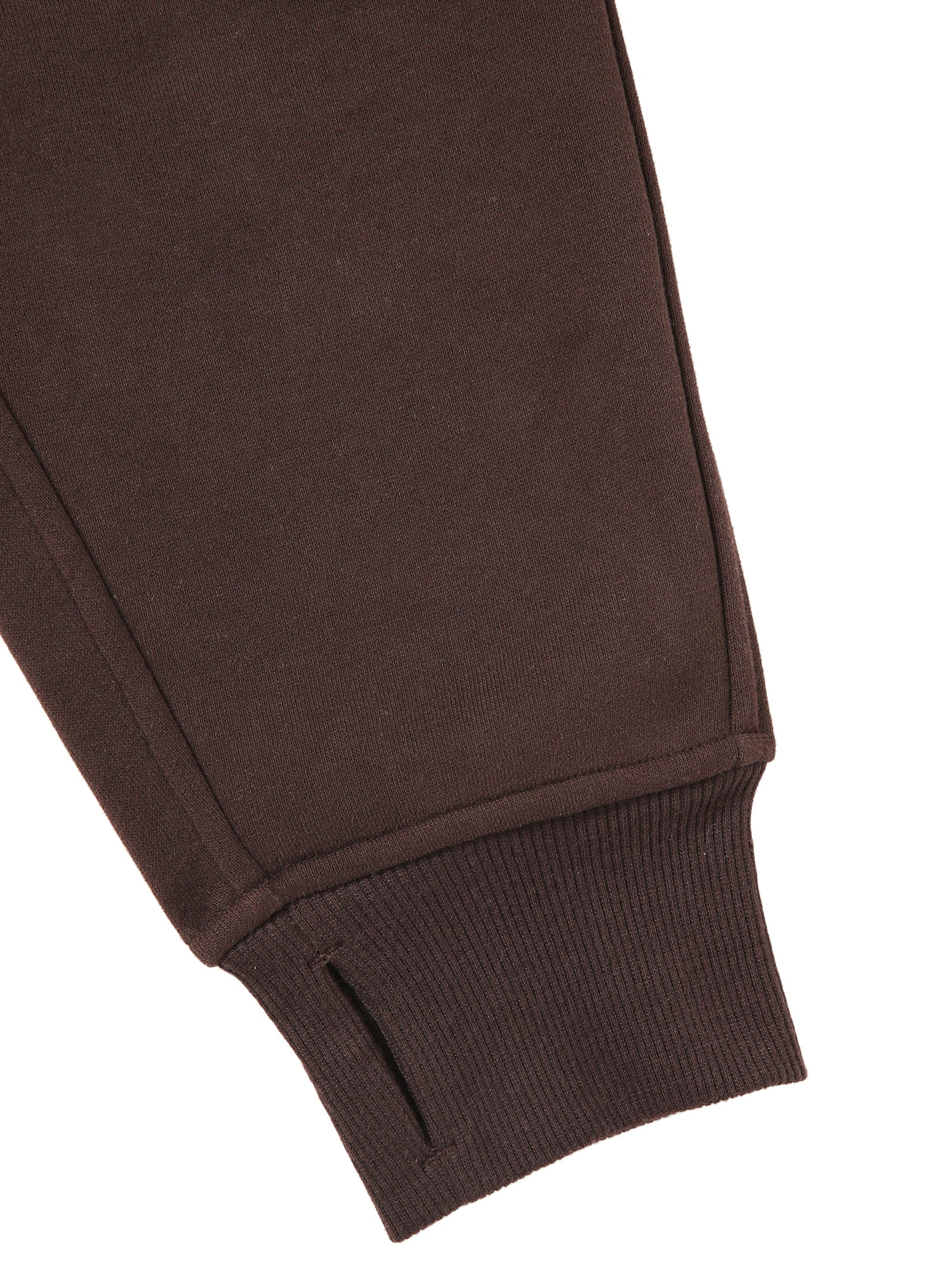 Detail of sleeve and cuff on chocolate brown cropped half-zip hoodie for women, featuring ribbed knit and thumbhole design.