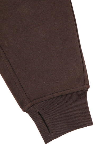 Detail of sleeve and cuff on chocolate brown cropped half-zip hoodie for women, featuring ribbed knit and thumbhole design.