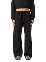Model wearing black Essential Drawstring Straight-Leg Sweatpants styled with a cropped sweatshirt, perfect for gym or casual wear.