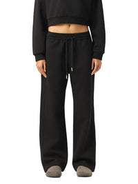 Model wearing black Essential Drawstring Straight-Leg Sweatpants styled with a cropped sweatshirt, perfect for gym or casual wear.