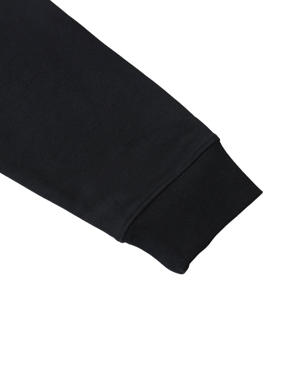 Premio Essential Oversized Hoodie sleeve detail showing ribbed cuff in black cotton blend for a relaxed streetwear fit.