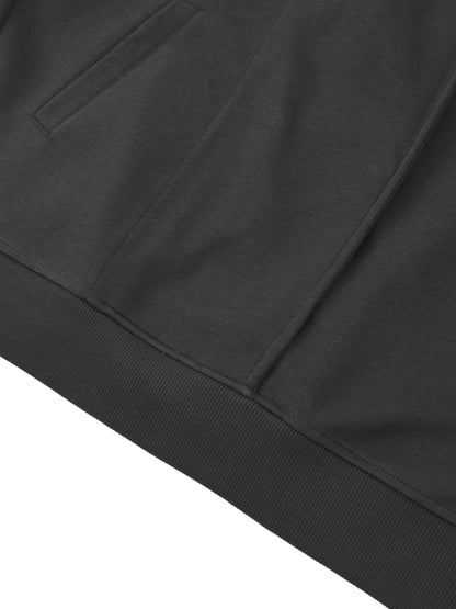Hem detail of black Essential Cotton T-Shirt hoodie, emphasizing ribbed waistband and premium cotton texture.