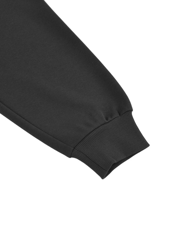 Detail of black Essential Cotton T-Shirt hoodie sleeve cuff, showing ribbed knit for a snug and stylish fit.