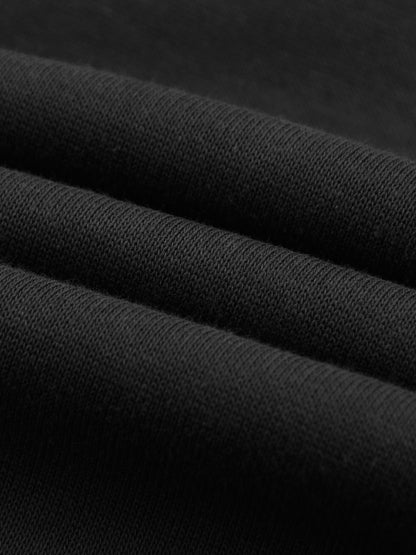Layered view of black cotton fabric from Essential Cotton T-Shirt hoodie, emphasizing 320 GSM thickness and quality.