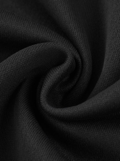 Swirled close-up of black cotton fabric from Essential Cotton T-Shirt hoodie, highlighting soft and breathable texture.