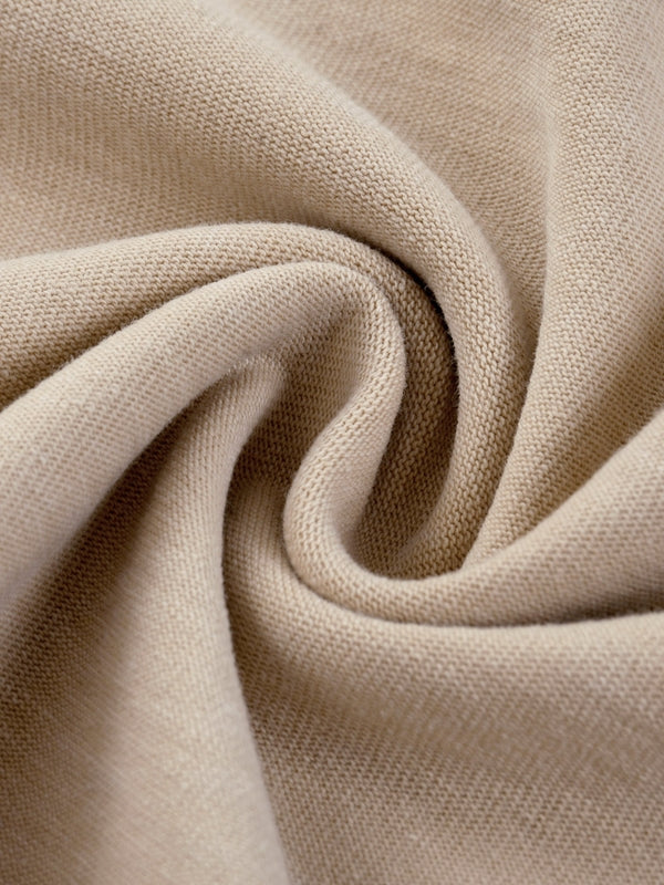 Fabric swirl of beige Mineral Wash Boxy Cotton T-Shirt showing soft, breathable 100% cotton material in fine detail.