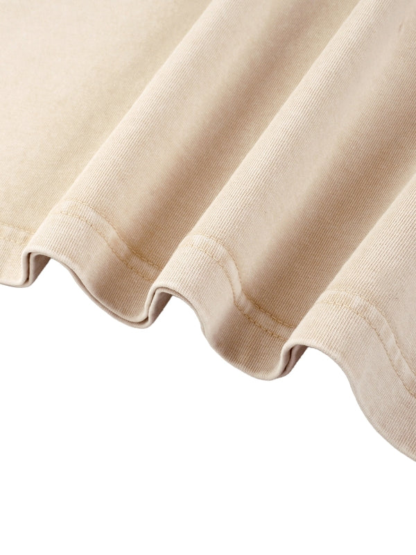 Close-up of beige Mineral Wash Boxy Cotton T-Shirt hem, showcasing durable stitching and soft cotton fabric.