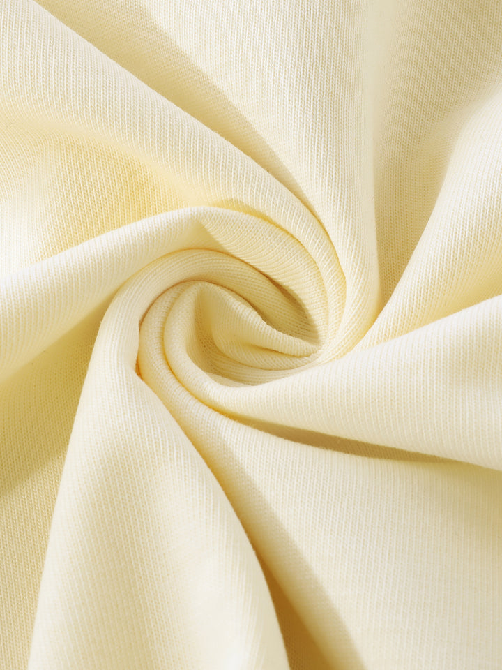 Close-up of beige fabric with a swirl pattern