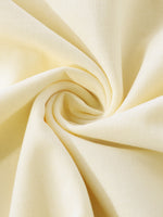 Close-up of beige fabric with a swirl pattern