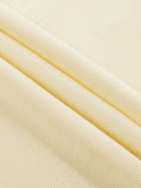 Close-up of beige fabric with a subtle texture