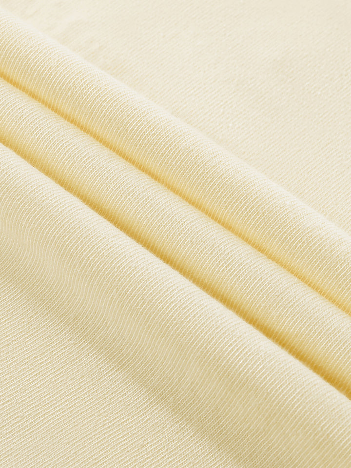 Close-up of beige fabric with a subtle texture