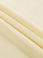 Close-up of beige fabric with a subtle texture
